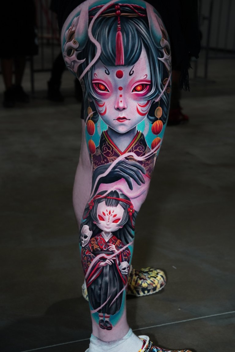 full leg evil doll tattoo style