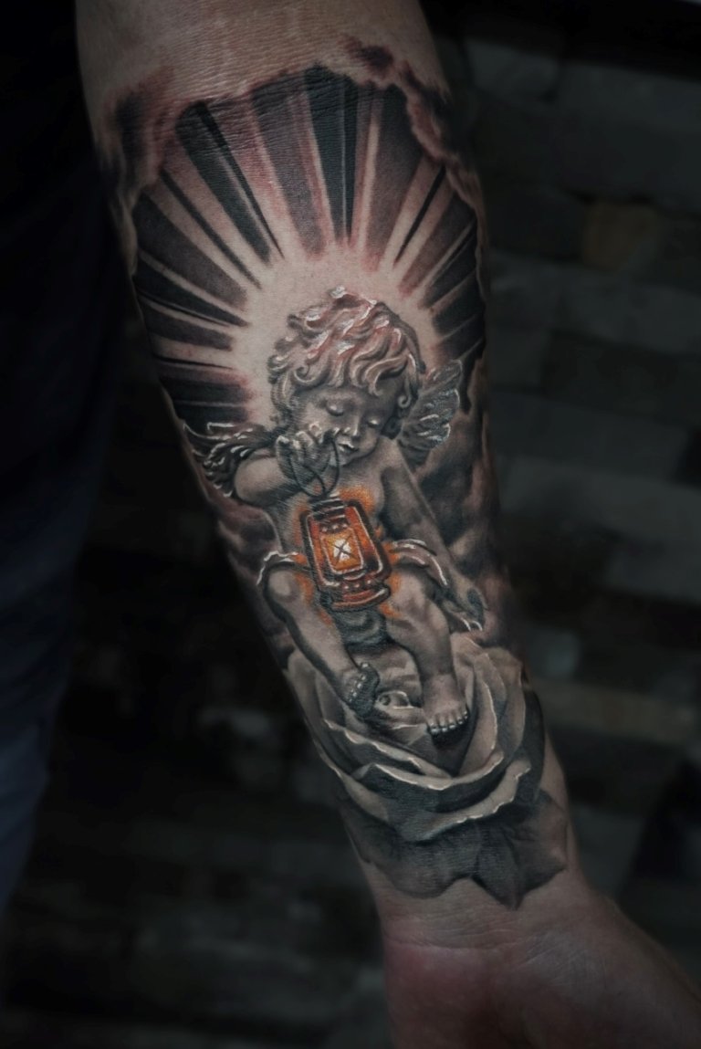 angel tattoo on arm