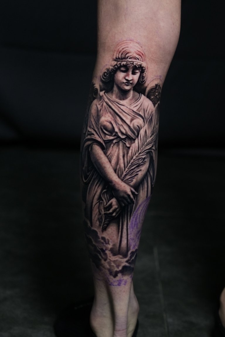 angel tattoo on leg