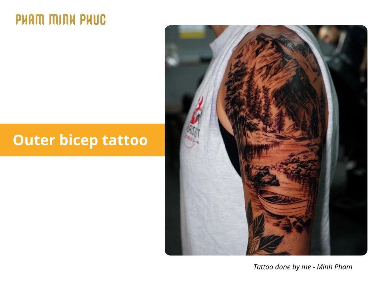 black and grey outer bicep tattoo