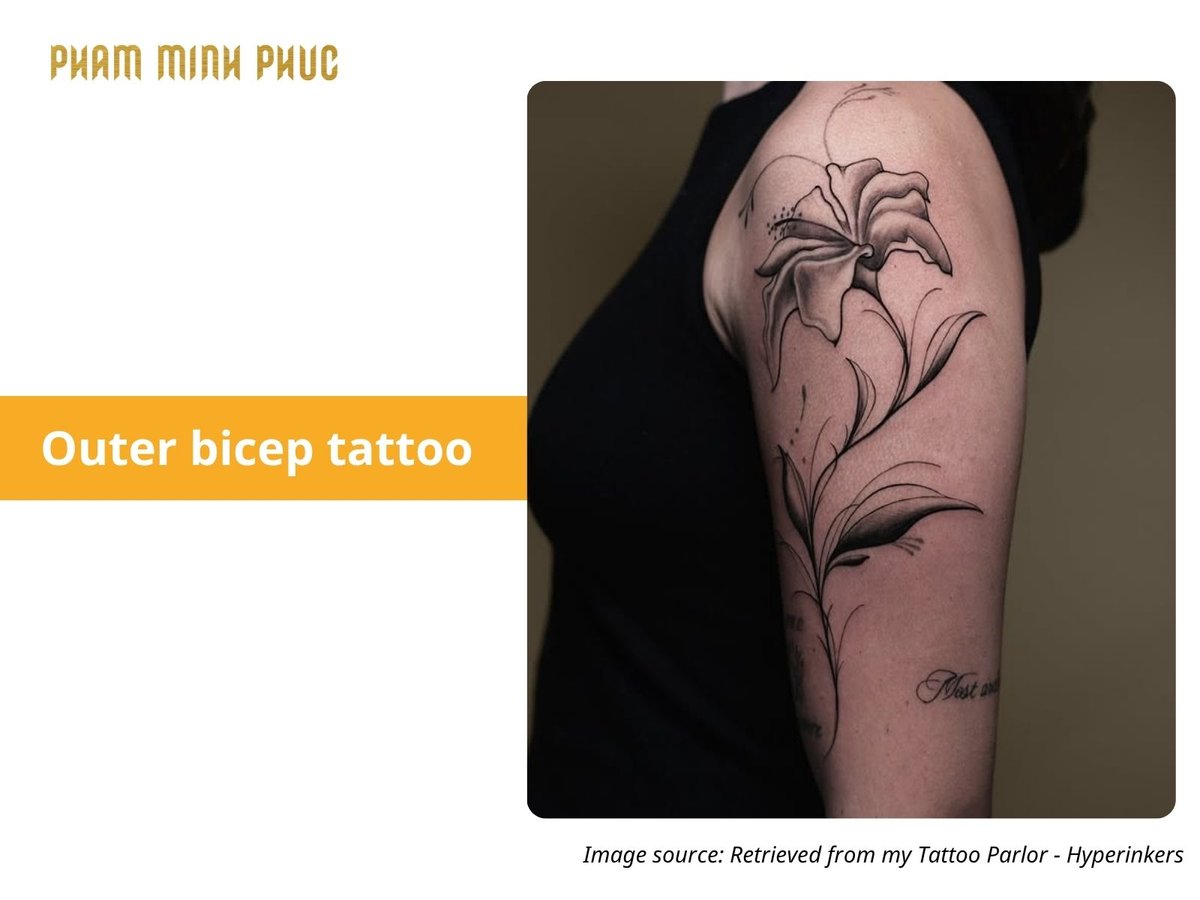 floral outer bicep tattoo