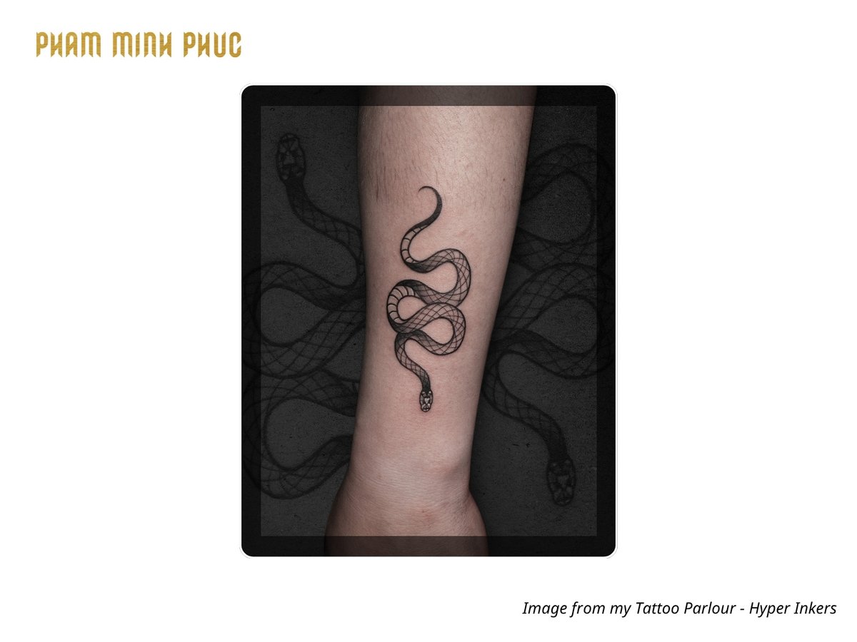 snake out wrist tattoo