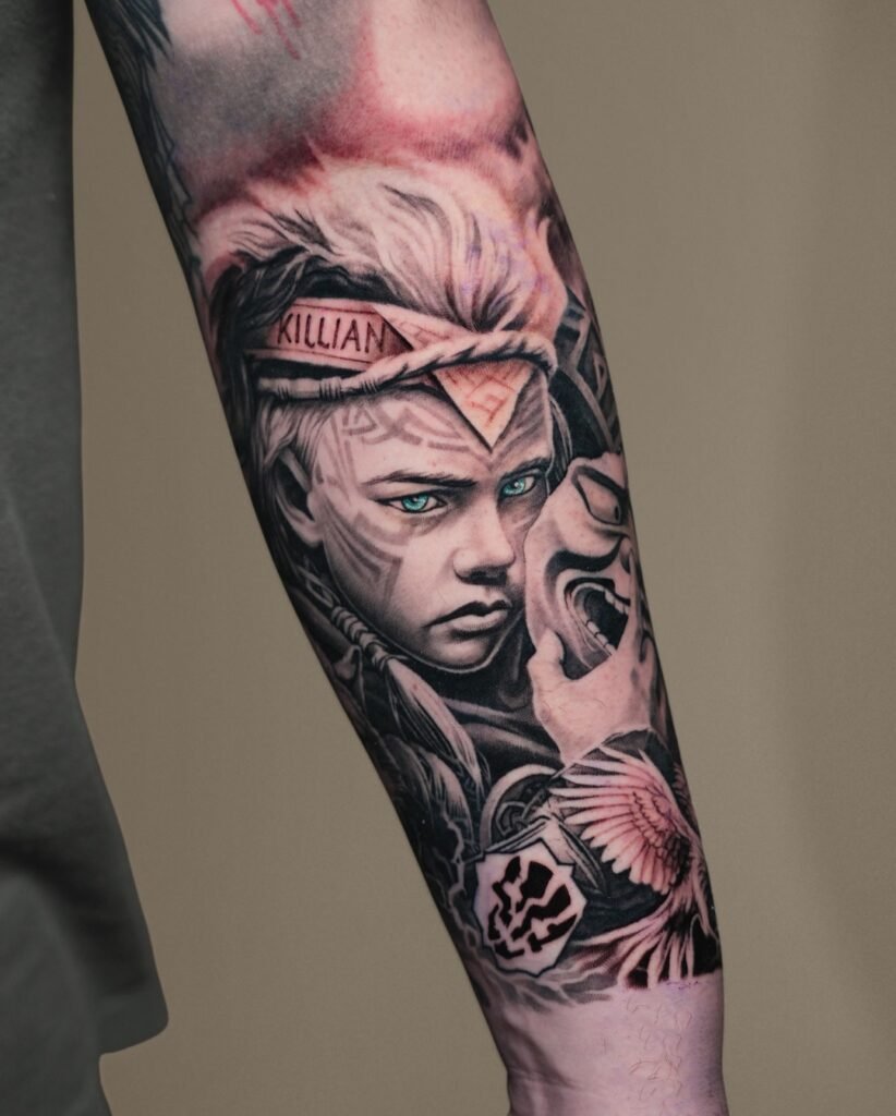 Black and grey realism portrait of a child warrior with a feathered headband and demon mask on a forearm sleeve