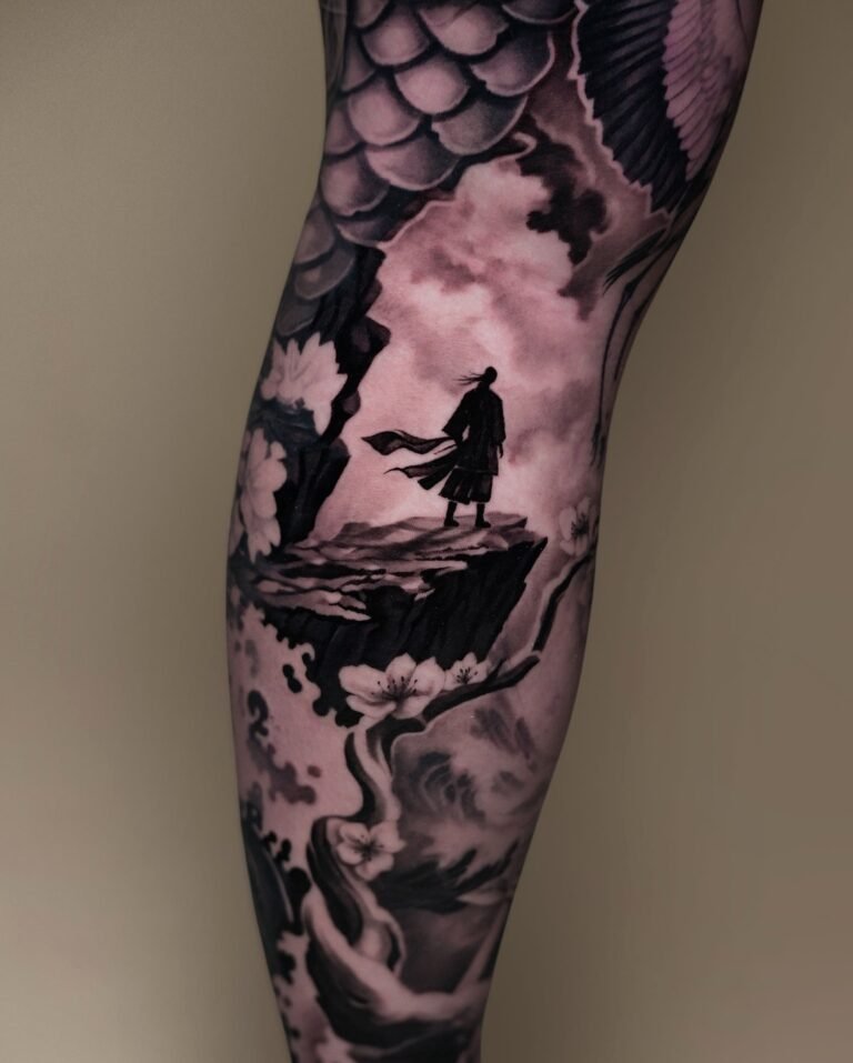 Black and grey tattoo of a lone samurai standing on a cliff with cherry blossoms and clouds